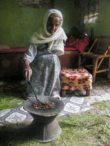 old-woman-roasting-coffee-in-ethiopia