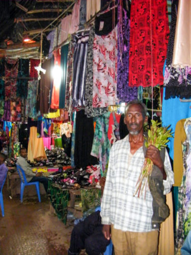 Man-holding-a-bunch-of-khat-in-a-market-in-somaliland