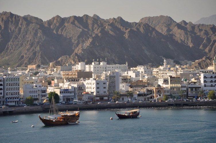 Muscat waterfront with mountains beyond