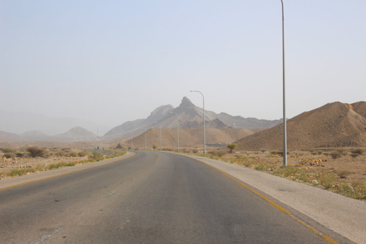 The road between Dubai and Muscat passing through mountainous desert landscapes