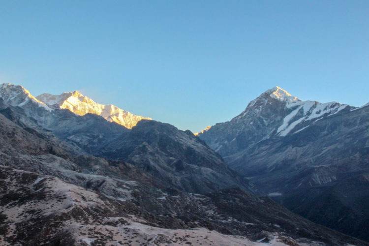 Sunlight hitting Kangchenjunga and Mount Pandim at sunrise