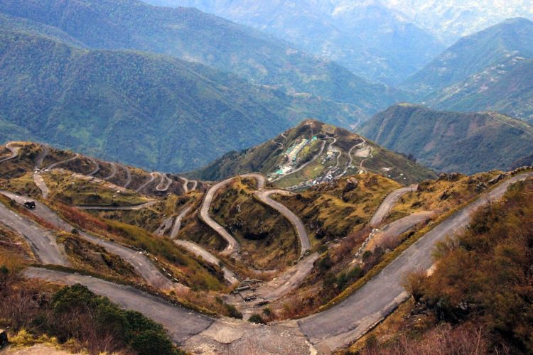 Narrow windy road through the mountains in Sikkim with many hairpins and switchbacks