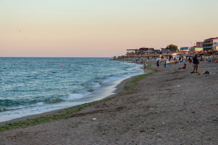 Vama-Veche-beach-at-sunset-with-warm-orange-colours-in-the-sky
