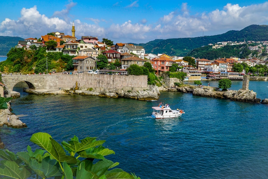 The old town and harbour of Amasra in Turkey with a boat in the water