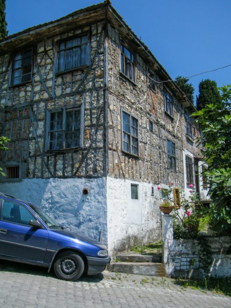 House-of-a-friendly-person-I-stayed-with-in-Northern-Turkey-with-my-old-blue-car-parked-on-the-sloped-road-outside