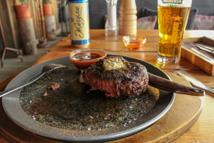 Horse-steak-on-a-plate-in-a-chalet-restaurant-in-shymbulak