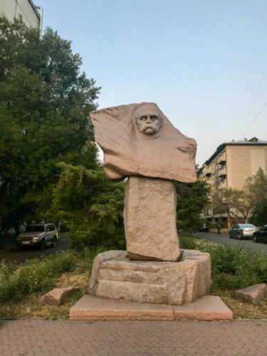 Abstract sculpture of a man in panfilov park in almaty