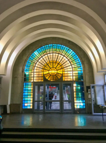 Colourful stained glass above the main entrance to Arasan Baths in Almaty