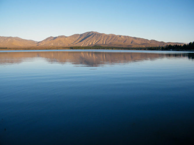 Reflection-of-mountains-in-lake-tekapo-at-golden-hour-before-sunset