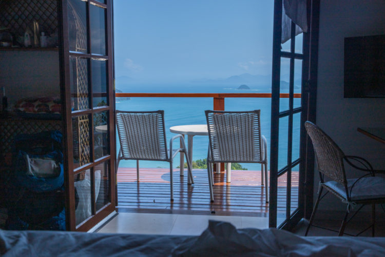 View of the deck and sea beyond from my bed inside the house