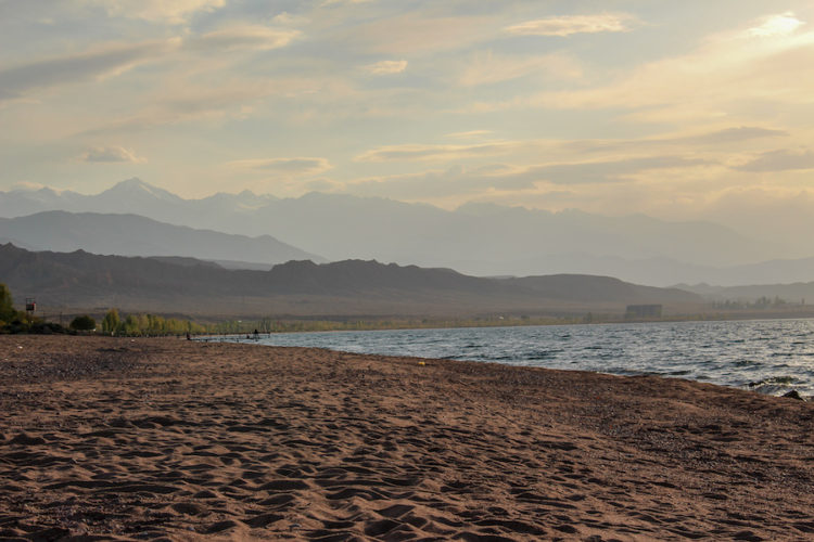 View of the mountains and Lake Issyk Kul from the beach at Legenda Health Resort in Kaji-Say