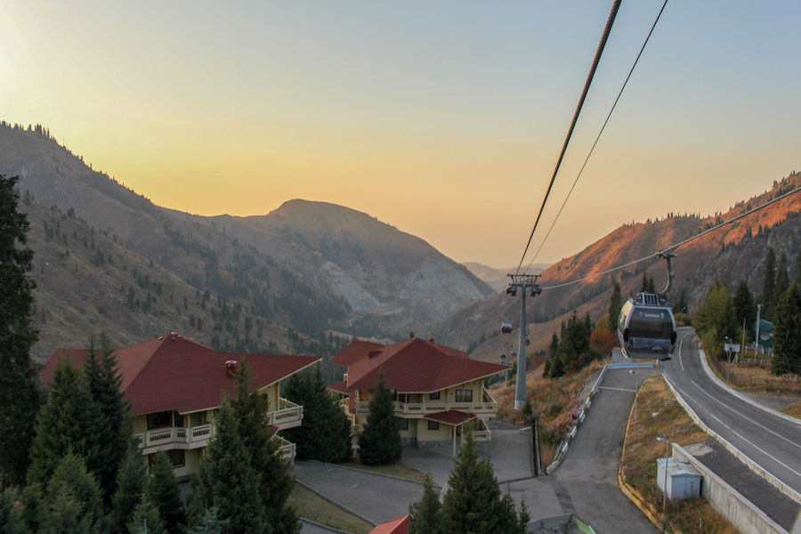 View-of-mountain-lodges-from-the-cable-car-from-medeu-to-shymbulak-with-sunset-colours-in-the-sky