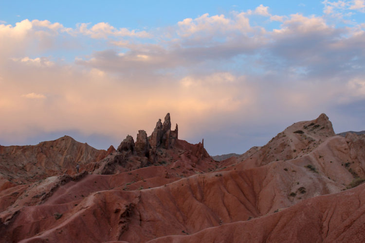 Spiky rock formations and red ridges at Skazka Canyon