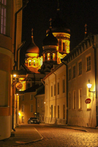 Atmospheric streets of Toompea at night with the onion domes of the orthodox cathedral in the distance