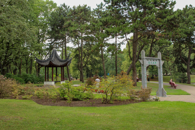 Chinese pavilion and stone arch in Kronvalda Park