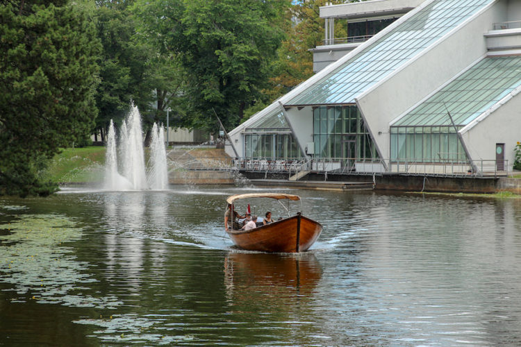 Boat taking people for a ride on the canal in Kronvalda Park