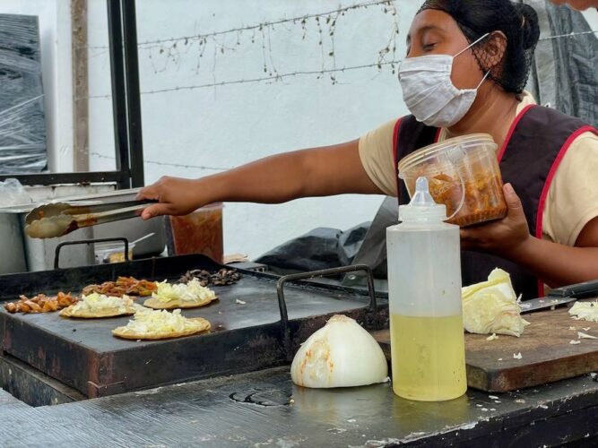 Mexican-street-food-vendor-preparing-tacos-in-yucatan