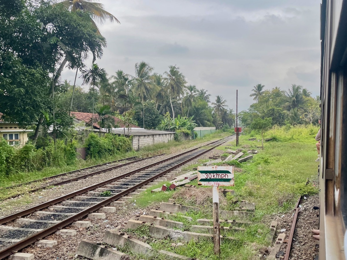 view-of-railway-tracks-out-of-the-window-of-a-train-in-sri-lanka