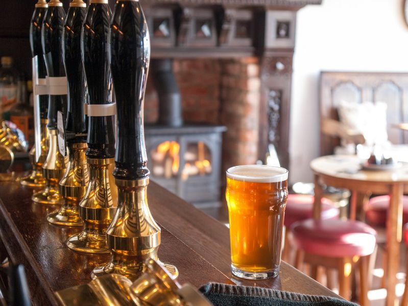English-pub-bar-with-beer-taps-and-pint-of-ale