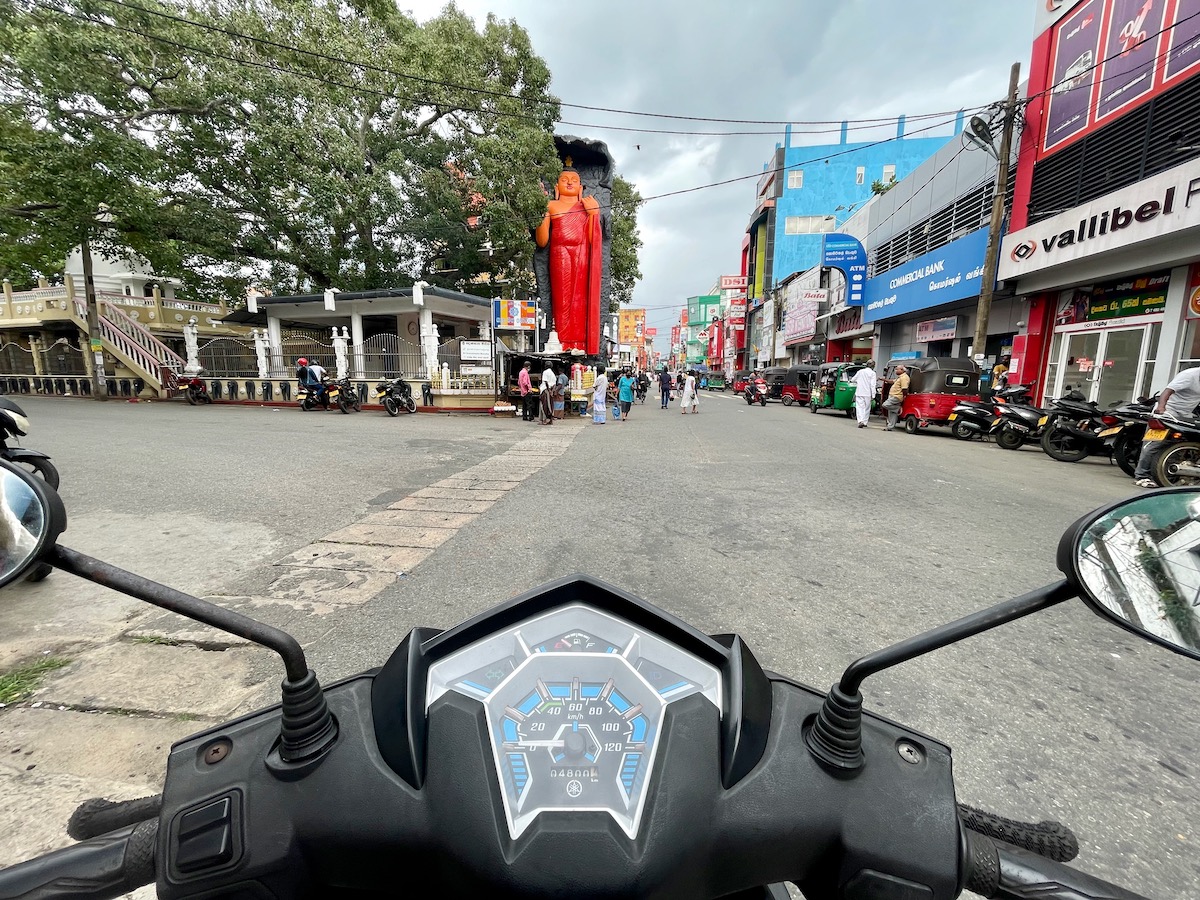driving a motorbike through the new town of galle
