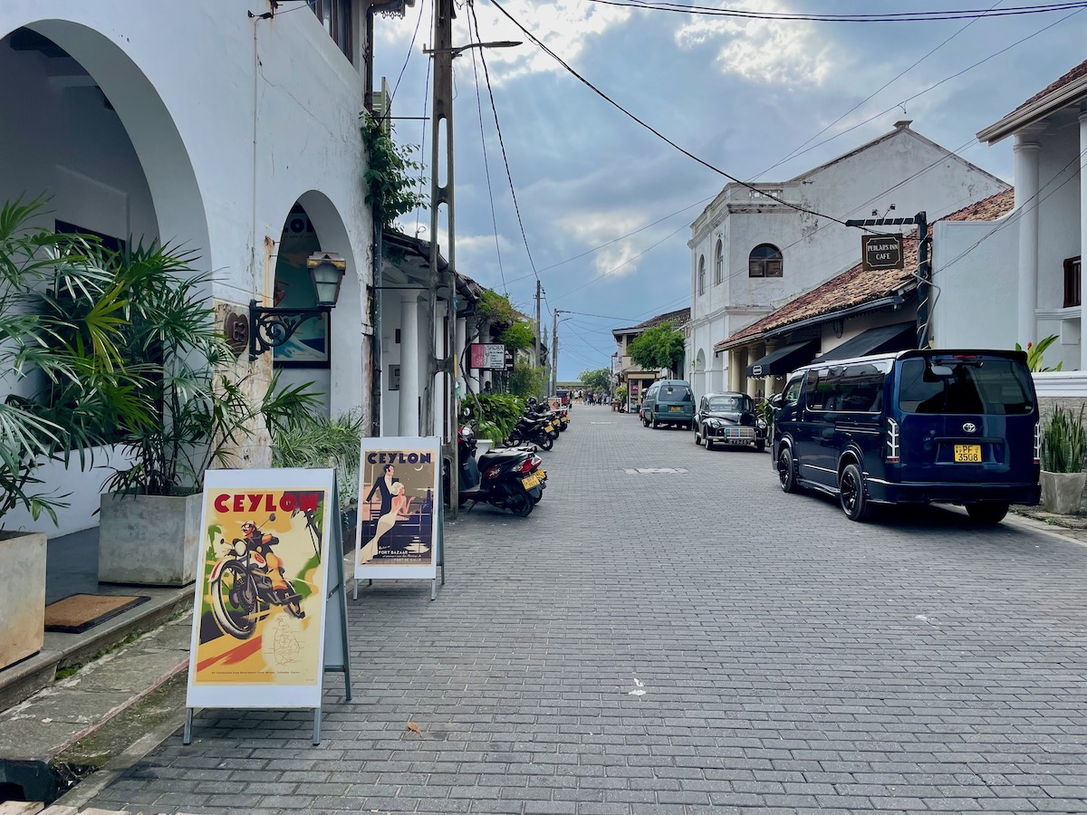 street in galle fort with ceylon posters outside