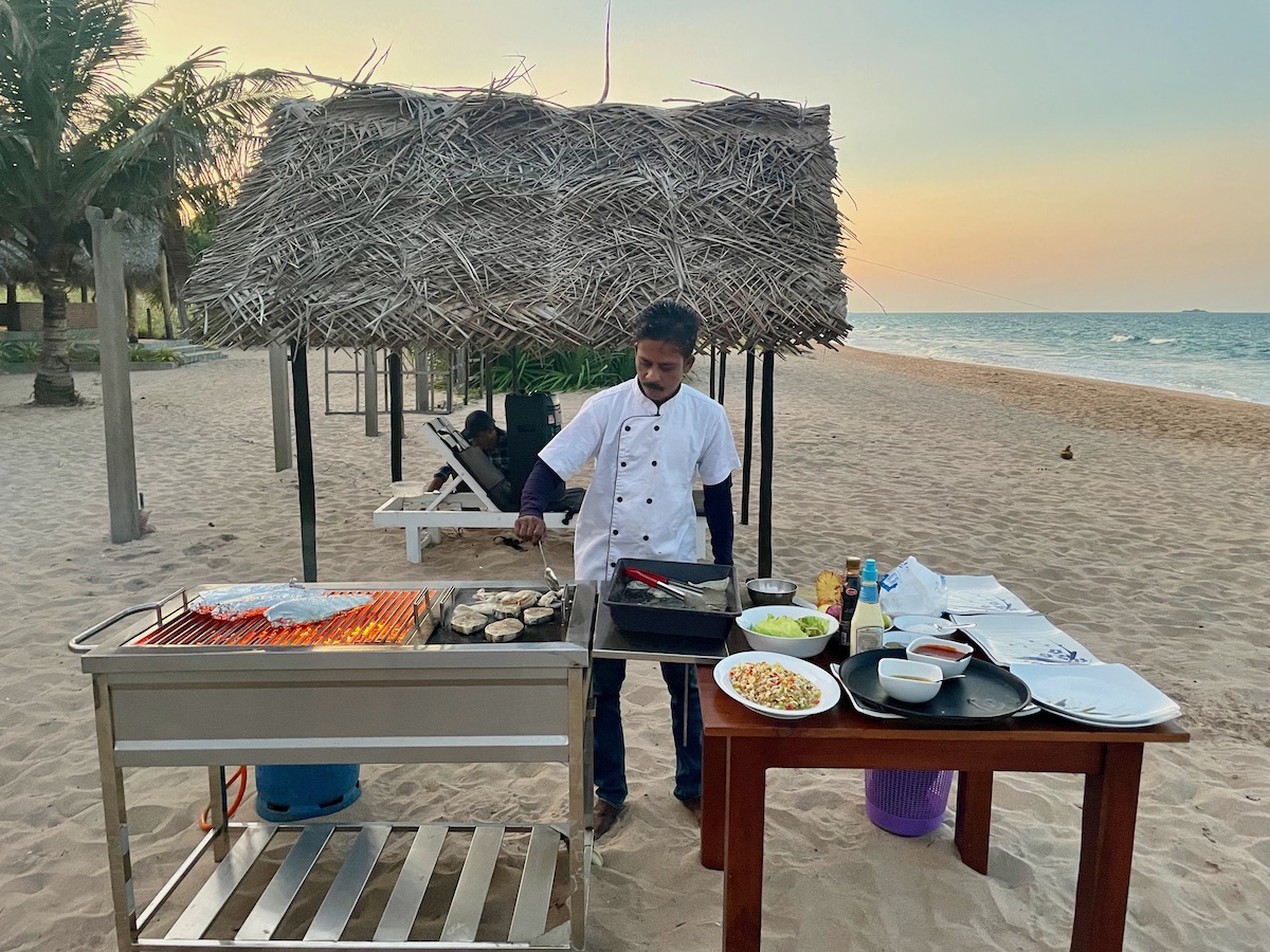 chef-in-white-shirt-doing-a-bbq-on-the-beach-at-nilaveli