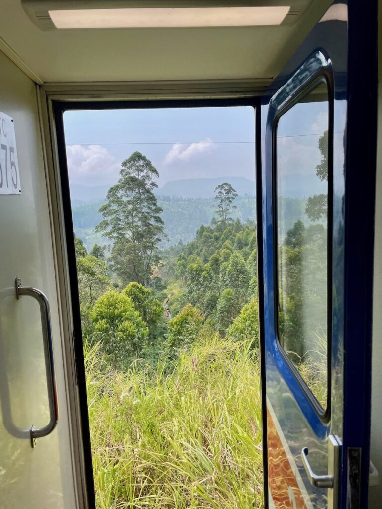 view-through-the-open-door-on-a-sri-lankan-train