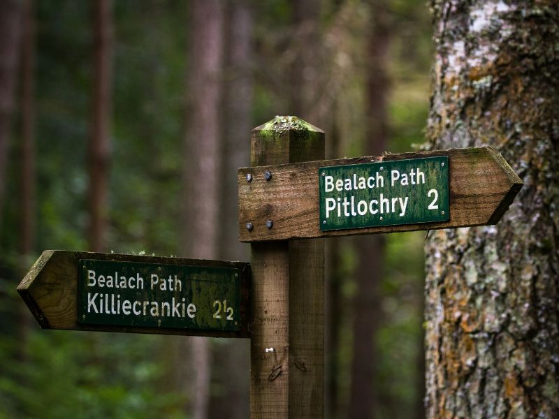 Footpath signs to Killiecrankie and Pitlochry in the forest