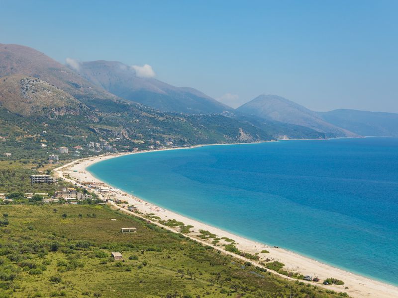 borsh-beach-with-mountains-behind