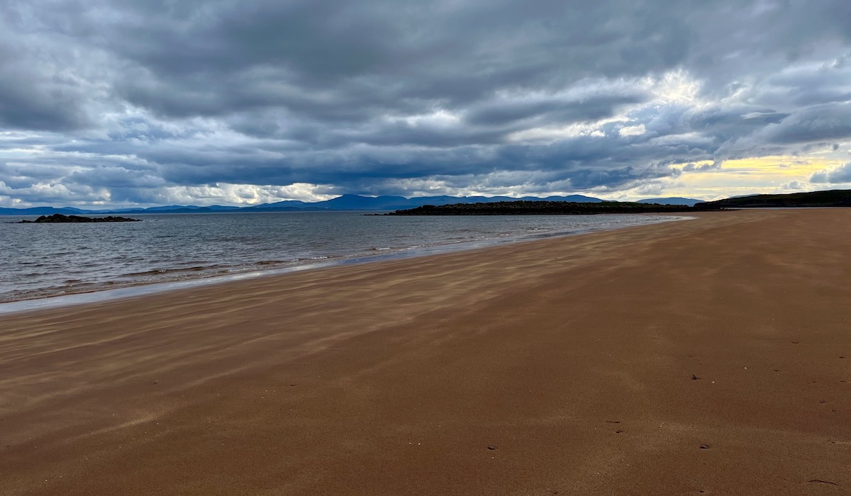 red-point-beach-in-scotland-with-moody-cloudy-sky