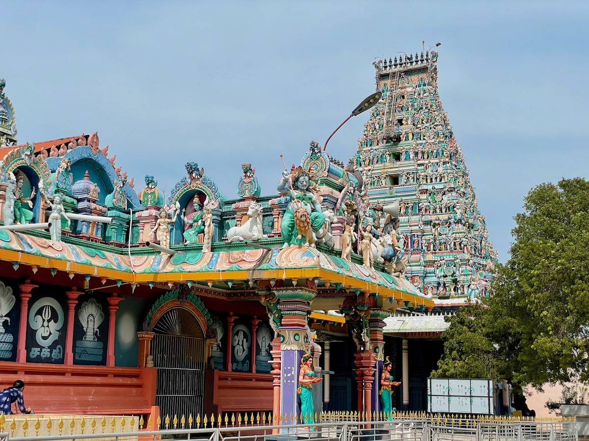 colourful-exterior-of-Nagapooshani-Amman-temple-showing-doorway-and-large-tower