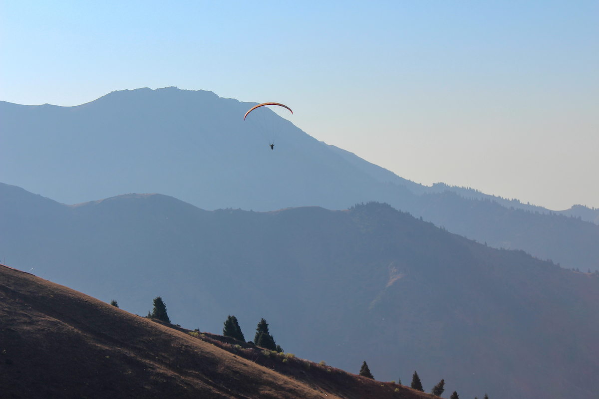 paraglider in the mountains near shymbulak close to almaty in Kazakhstan