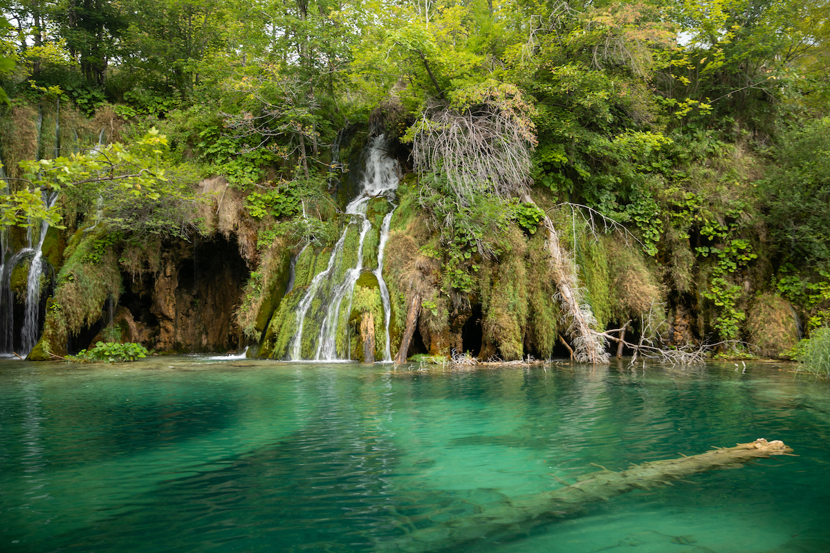 waterfall and turquoise water at plitvice lakes