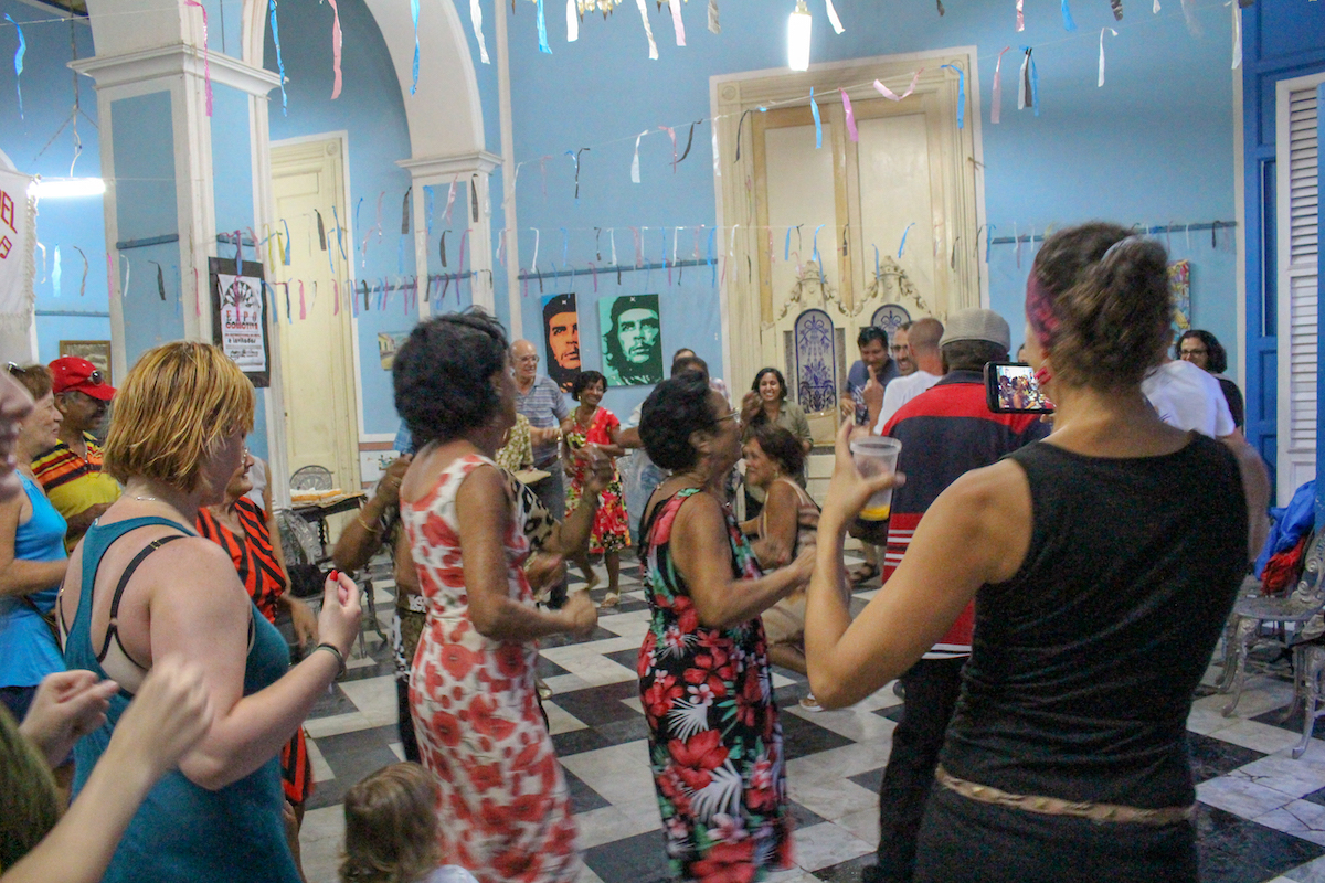people dancing salsa in an indoor salsa hall in trinidad cuba