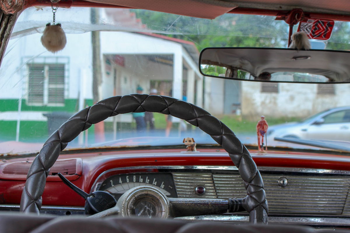 inside a classic vintage car in cuba