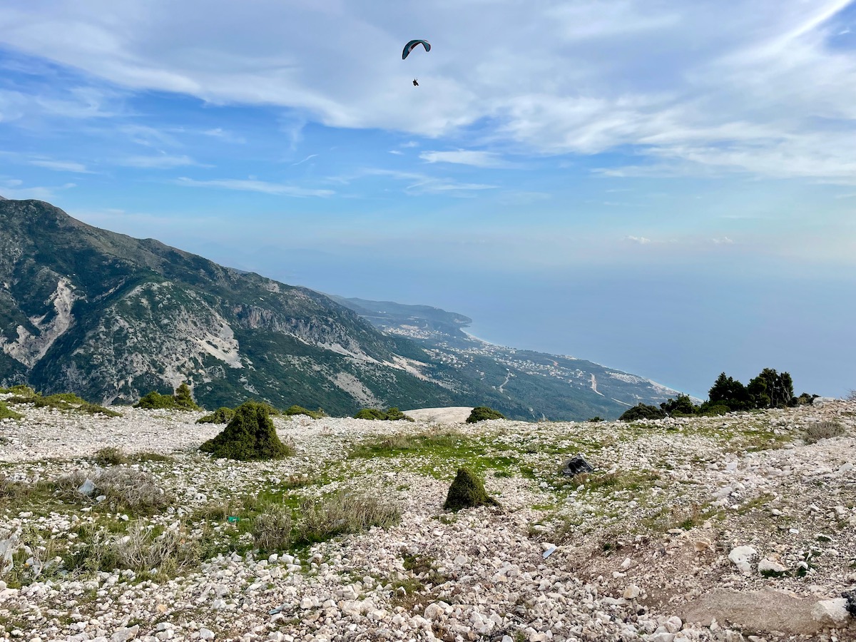 paragliding-in-the-mountains-along-the-albanian-riviera-with-views-of-the-sea