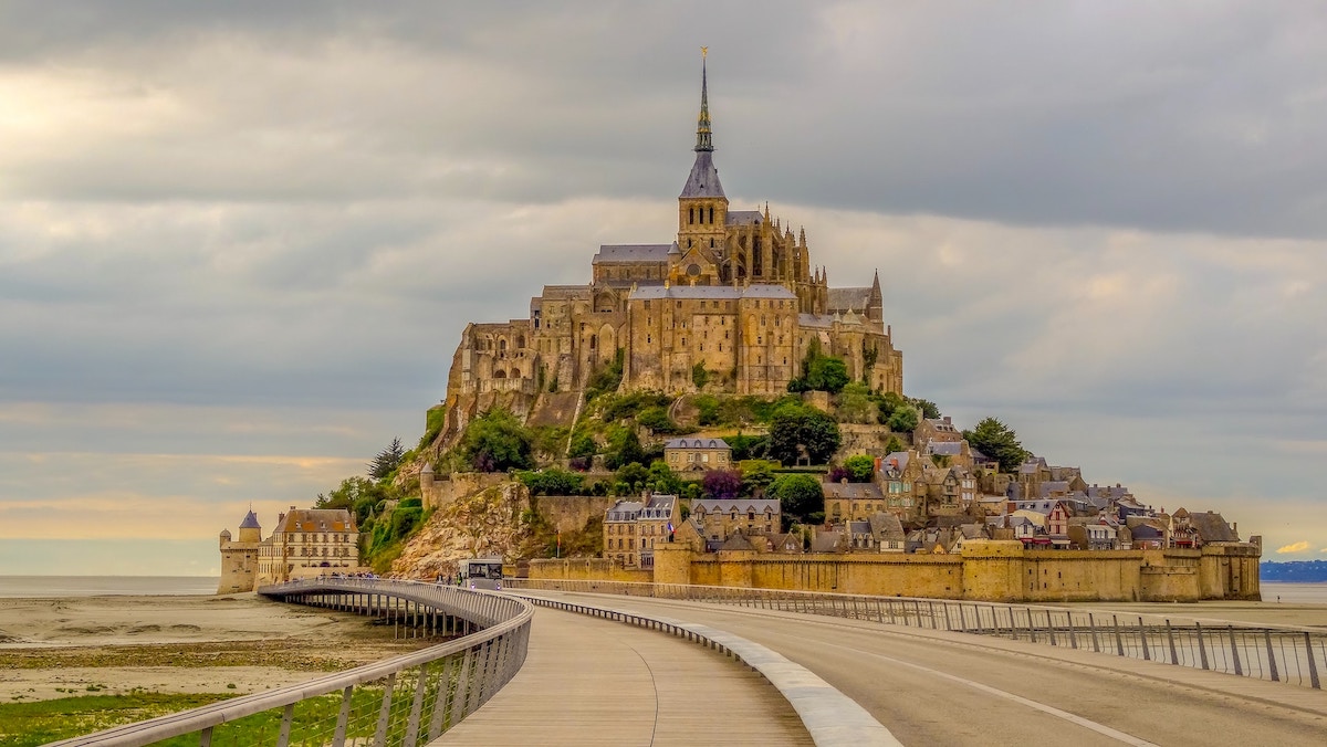 mont st michel in normandy with a cloudy sky