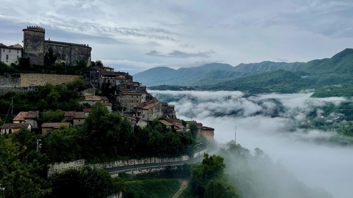 hilltop village of roviano italy with mist hanging in the valley