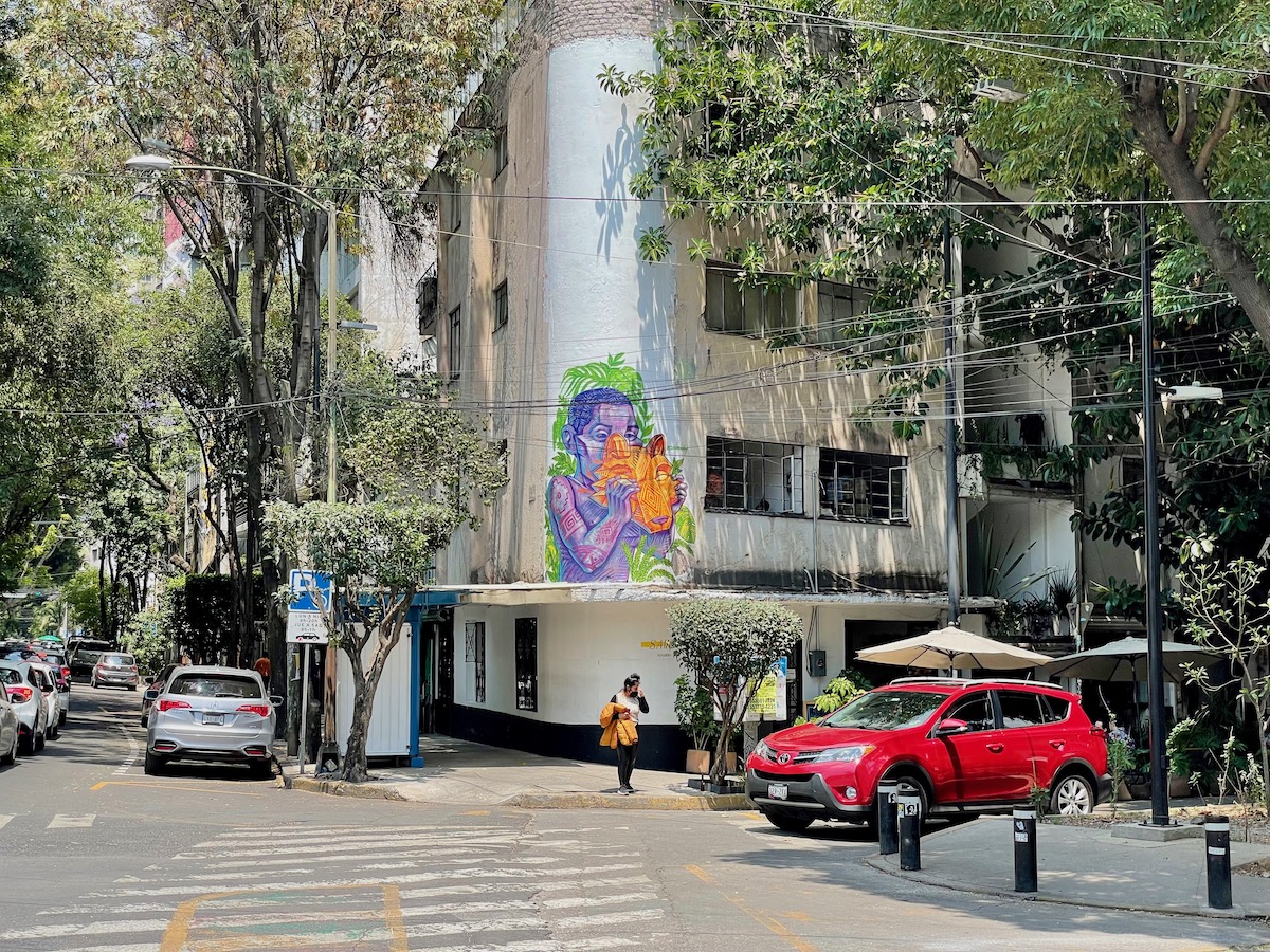 Attractive street in Condesa with mural and red car