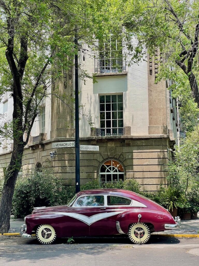 Vintage car outside art deco building in Condesa mexico city