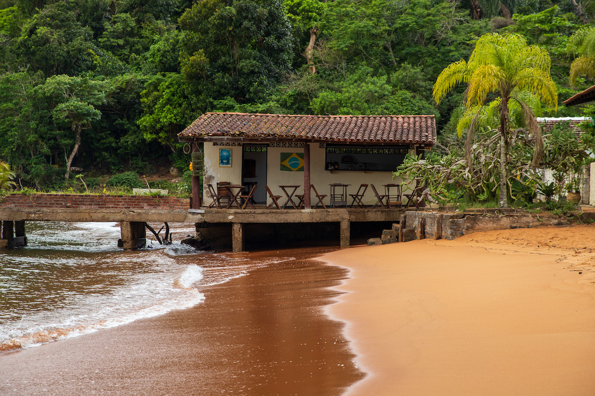 jetty with a little cafe on a remote beach in ilha grande