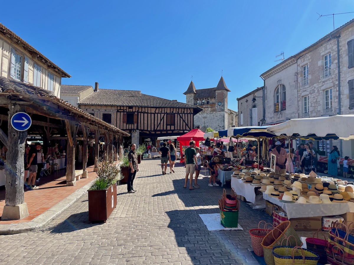 People shopping at the Villereal market on a sunny day in the summer