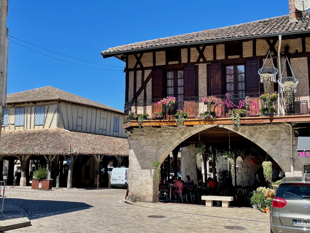 Medieval stone arcades and covered central market square in Villereal, France