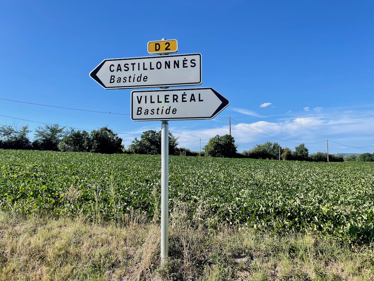 Road signs in rural southwestern France pointing to Castillonnes and Villereal