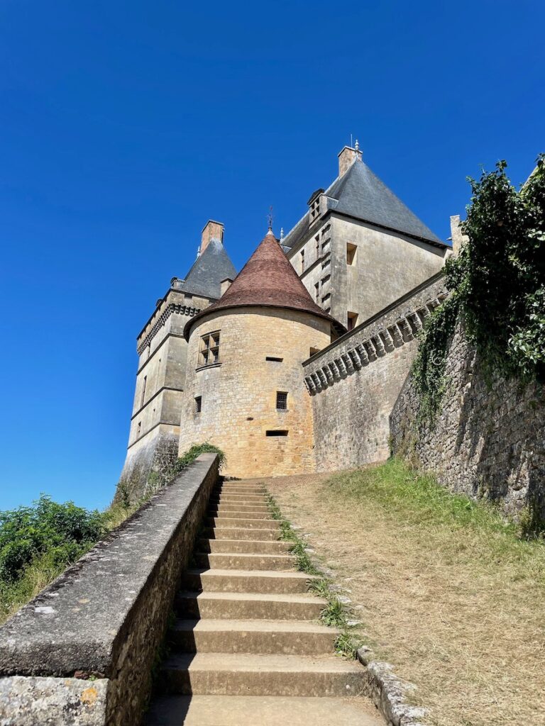 Steps leading up to a tower along the walls of Chateau de Biron